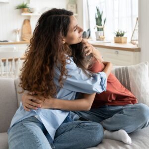 woman hugging child